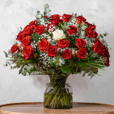 Fifty Red & One White Roses bouquet, fifty red roses accented with a single white rose